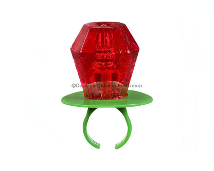 Colorful red Ring Pop candy mounted on a green plastic ring, representing bulk American candy.